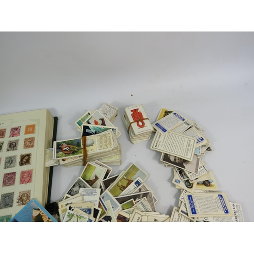 613 - Mixed lot to include a world stamp album, full Ogdens cigarette card album and a selection of loose ... 