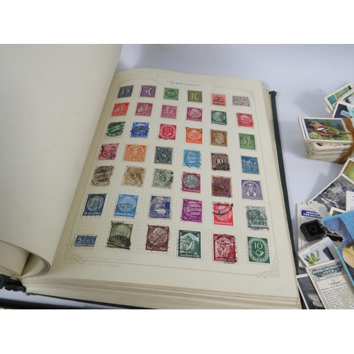 613 - Mixed lot to include a world stamp album, full Ogdens cigarette card album and a selection of loose ... 