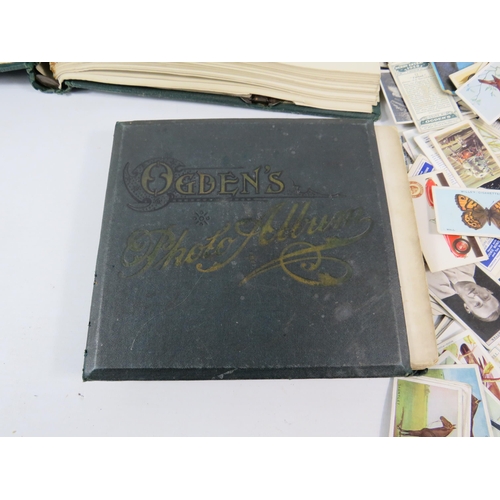 613 - Mixed lot to include a world stamp album, full Ogdens cigarette card album and a selection of loose ... 