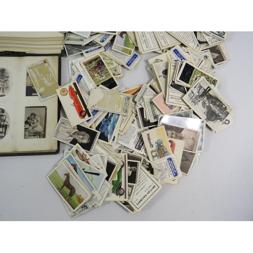 613 - Mixed lot to include a world stamp album, full Ogdens cigarette card album and a selection of loose ... 