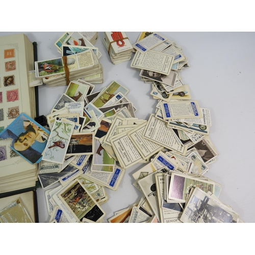 613 - Mixed lot to include a world stamp album, full Ogdens cigarette card album and a selection of loose ... 