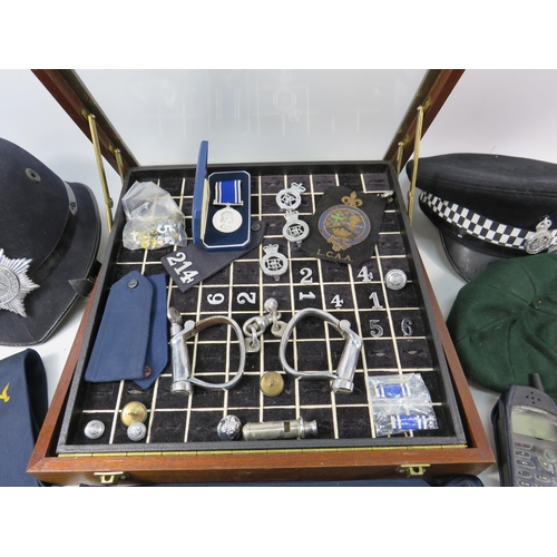 616 - Policemans Helmet, Hat, whistle, cuffs, numbers, medal etc plus a ring display box. 40