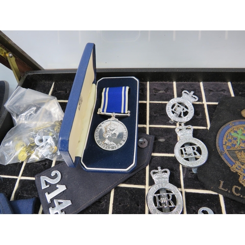 616 - Policemans Helmet, Hat, whistle, cuffs, numbers, medal etc plus a ring display box. 40