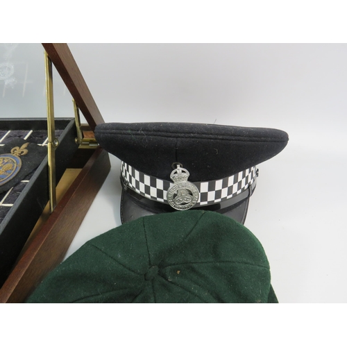 616 - Policemans Helmet, Hat, whistle, cuffs, numbers, medal etc plus a ring display box. 40