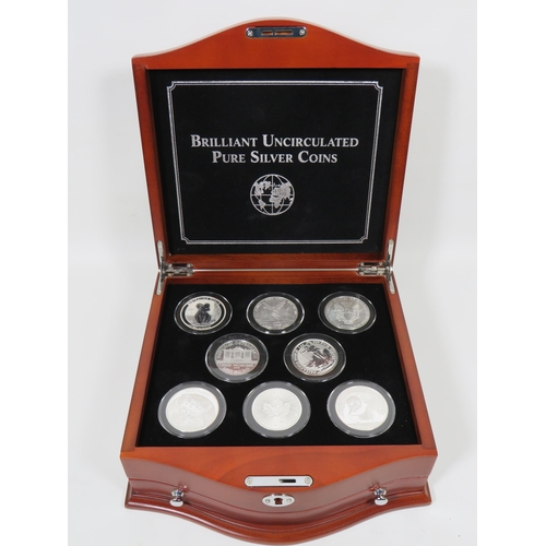 337 - Danbury Mint Presentation Chest of Silver Coins from Eight Countries ,  each with COA and weighs 31.... 