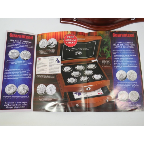 337 - Danbury Mint Presentation Chest of Silver Coins from Eight Countries ,  each with COA and weighs 31.... 