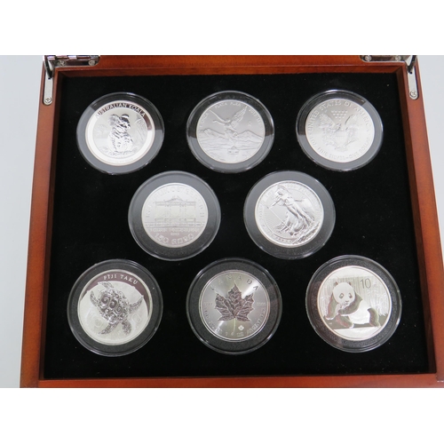 337 - Danbury Mint Presentation Chest of Silver Coins from Eight Countries ,  each with COA and weighs 31.... 