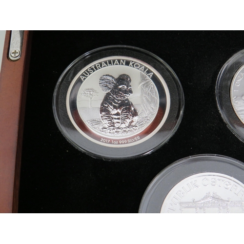 337 - Danbury Mint Presentation Chest of Silver Coins from Eight Countries ,  each with COA and weighs 31.... 