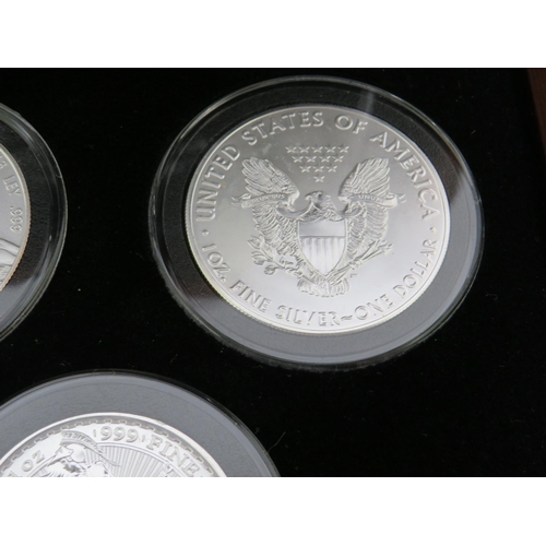 337 - Danbury Mint Presentation Chest of Silver Coins from Eight Countries ,  each with COA and weighs 31.... 