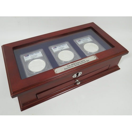 338 - Danbury Mint Early Issue USA silver dollar set of Three Coins set in a wooden display case with lock... 