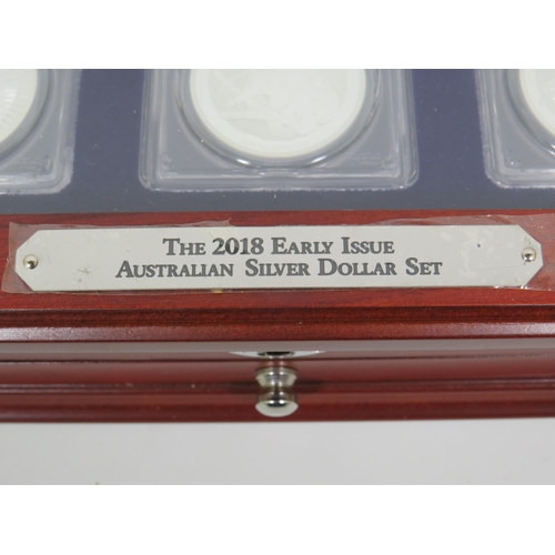 338 - Danbury Mint Early Issue USA silver dollar set of Three Coins set in a wooden display case with lock... 