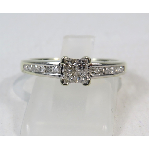 269a - 9ct White Gold Diamond ring, four main diamonds set in a square with six round diamonds on each shou... 