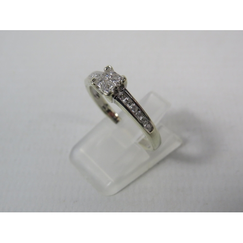 269a - 9ct White Gold Diamond ring, four main diamonds set in a square with six round diamonds on each shou... 