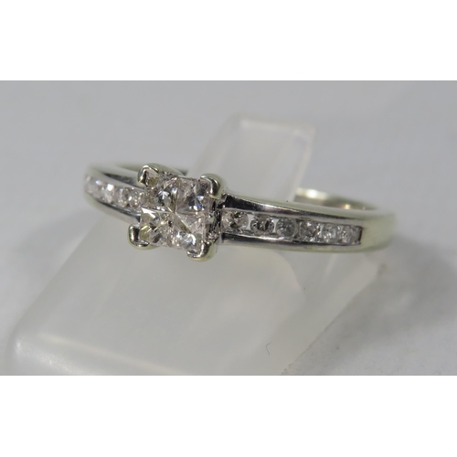 269a - 9ct White Gold Diamond ring, four main diamonds set in a square with six round diamonds on each shou... 