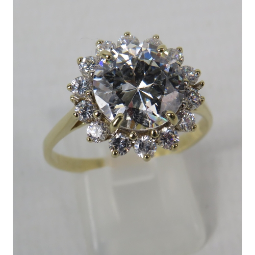 271a - 9ct Yellow Gold Ring set with one large 10mm and fourteen x 2mm Cubic Zirconia's in a flower pattern... 