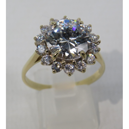 271a - 9ct Yellow Gold Ring set with one large 10mm and fourteen x 2mm Cubic Zirconia's in a flower pattern... 