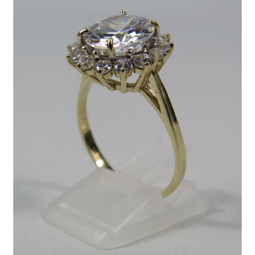 271a - 9ct Yellow Gold Ring set with one large 10mm and fourteen x 2mm Cubic Zirconia's in a flower pattern... 