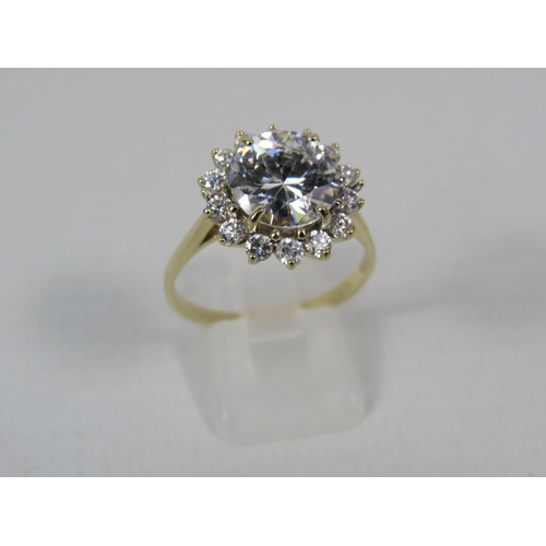 271a - 9ct Yellow Gold Ring set with one large 10mm and fourteen x 2mm Cubic Zirconia's in a flower pattern... 