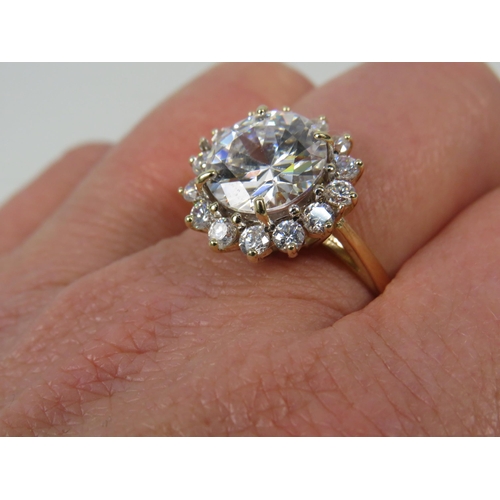 271a - 9ct Yellow Gold Ring set with one large 10mm and fourteen x 2mm Cubic Zirconia's in a flower pattern... 