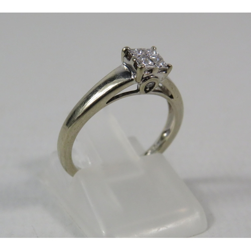 277a - 18ct White Gold Diamond ring set with Four central diamonds .32ct, Finger size I.5. 2.5 grams