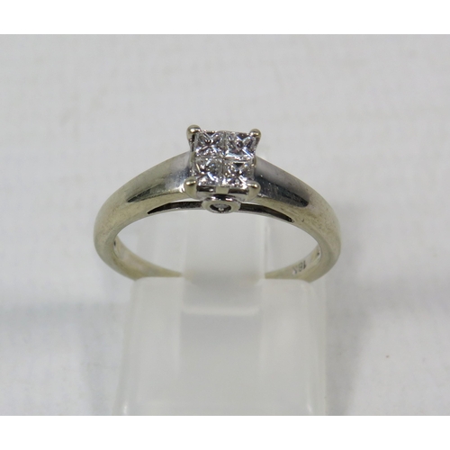 277a - 18ct White Gold Diamond ring set with Four central diamonds .32ct, Finger size I.5. 2.5 grams