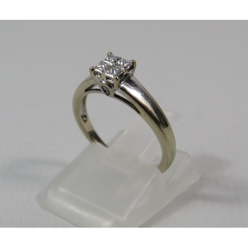 277a - 18ct White Gold Diamond ring set with Four central diamonds .32ct, Finger size I.5. 2.5 grams