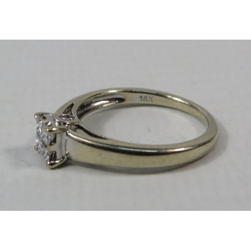 277a - 18ct White Gold Diamond ring set with Four central diamonds .32ct, Finger size I.5. 2.5 grams