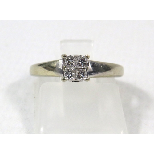 277a - 18ct White Gold Diamond ring set with Four central diamonds .32ct, Finger size I.5. 2.5 grams