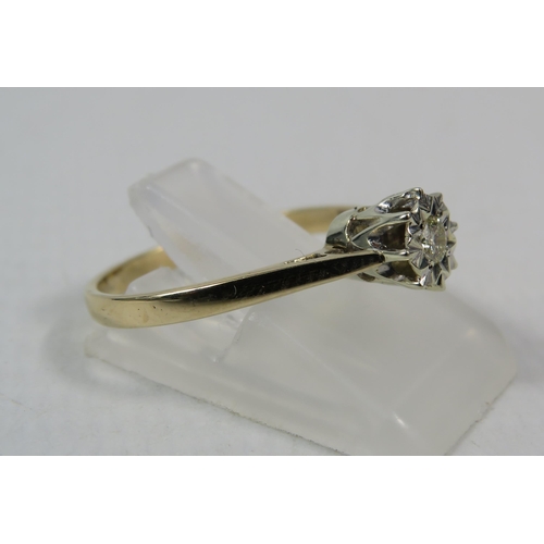 283a - 9ct Yellow gold illusion set diamond ring .10ct, finger size P. 1.8 grams