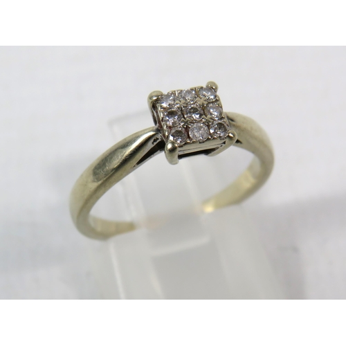 286a - 18ct White gold ring set with nine diamonds in a square, .13 ct, finger size K. 3 grams.