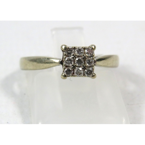 286a - 18ct White gold ring set with nine diamonds in a square, .13 ct, finger size K. 3 grams.