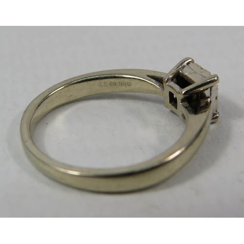 286a - 18ct White gold ring set with nine diamonds in a square, .13 ct, finger size K. 3 grams.