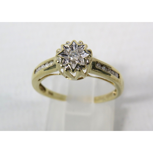 287a - 9ct Yellow gold 15pt diamond ring, Central diamond set within a star illusion and Five diamonds to e... 