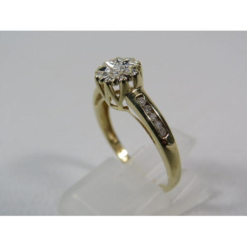 287a - 9ct Yellow gold 15pt diamond ring, Central diamond set within a star illusion and Five diamonds to e... 