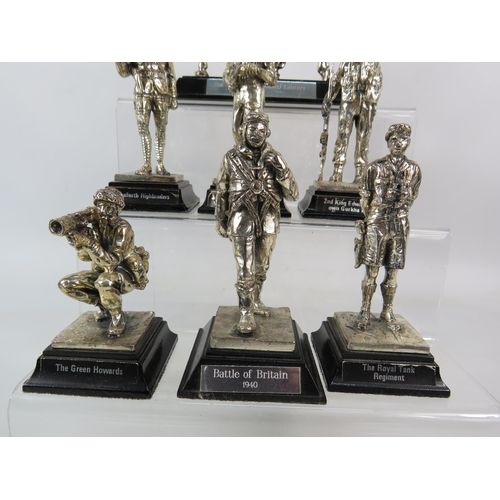 633 - Seven Royal Hampshire white metal figurines of Soldiers, various Regiments. The tallest stands 6