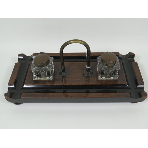 823 - Darkwood desk set with original brass topped glass inkwells in excellent condition. Measures approx ... 