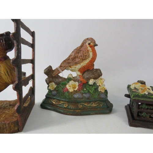 652 - A Cast iron mechanic dog money box, Scotty dog book end and Robin door stop.