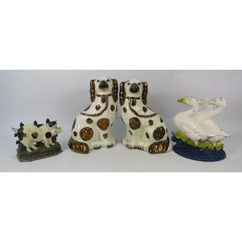 676 - A Pair of antique porcelain Staffordshire dogs with copper lustre spots, a cast iron letter rack and... 