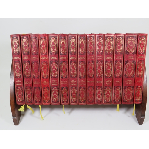 758 - Small Oak Portable Bookshelf which comes with Eight leather bound editions of Dennis Wheatley Novels... 