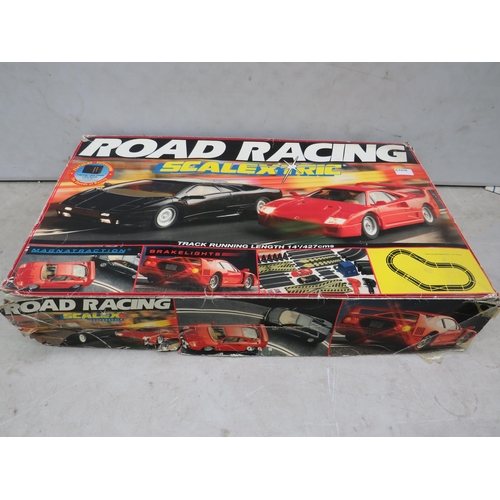 761 - Scalextric Road Racing Set which appears to be complete. Box in complete but tatty condition. See ph... 