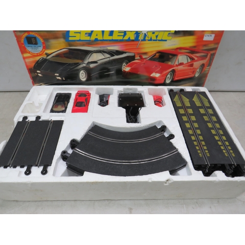 761 - Scalextric Road Racing Set which appears to be complete. Box in complete but tatty condition. See ph... 