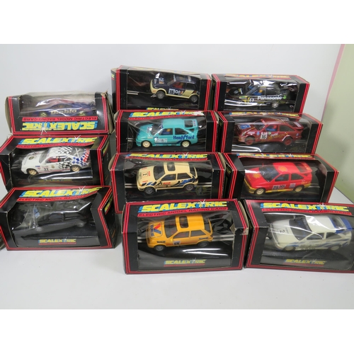 764 - 13 Scalextric Model Racing cars, All in unused condition with boxes, (two boxes are crushed and tatt... 