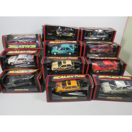 764 - 13 Scalextric Model Racing cars, All in unused condition with boxes, (two boxes are crushed and tatt... 