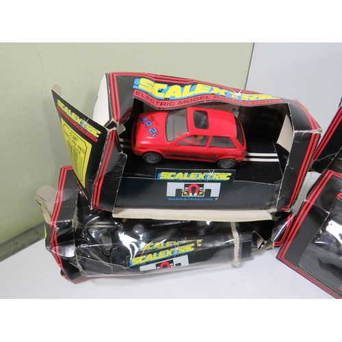 764 - 13 Scalextric Model Racing cars, All in unused condition with boxes, (two boxes are crushed and tatt... 