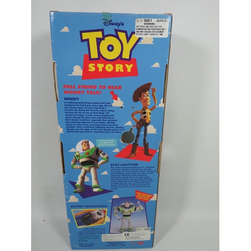 766 - Two Disney Toy Story Figures, Buzz Lightyear and Woody. Both have original boxes and appear to be in... 