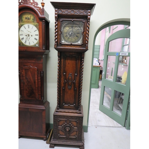 770 - Vintage long case clock with Metal face and extensive carving to body. It has non original mechanism... 