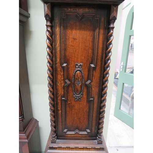 770 - Vintage long case clock with Metal face and extensive carving to body. It has non original mechanism... 