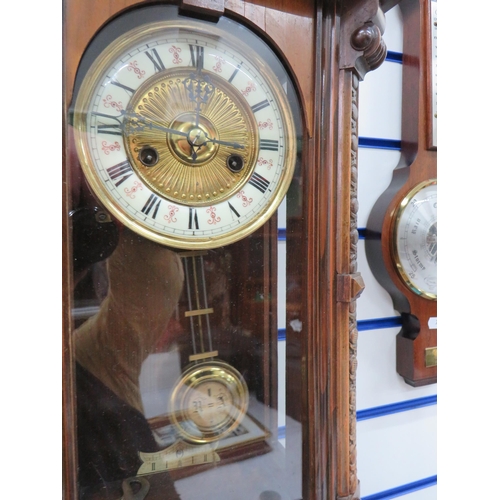 774 - German Wall mounted Vienna wall clock C1900 with key and pendulum in running order along with a wall... 