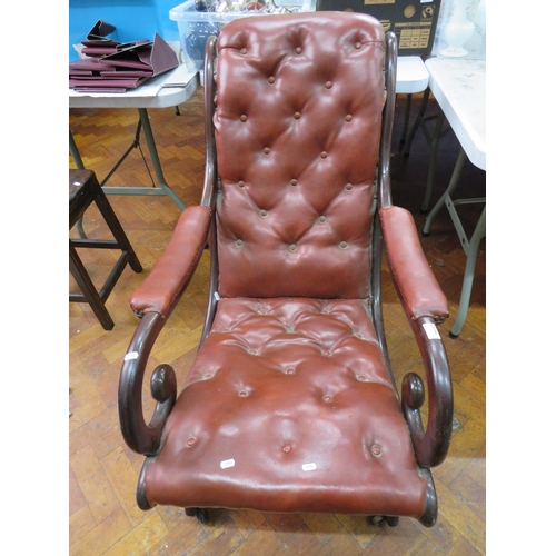 779 - Late 19th Century X frame Recliner with buttoned leather upholstery along with an adjustable Gout st... 