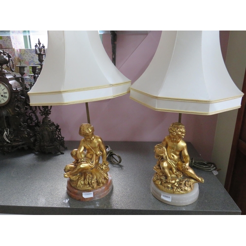 782 - Pair of Gold Painted Spelter Lamp bases featuring Cherub bodies,  Brass light column.  Each raised o... 